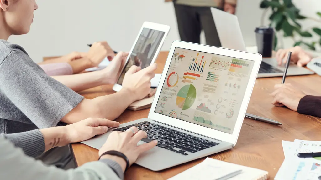 a group of people using laptops