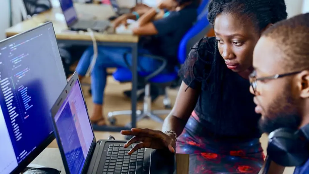 a woman looking at a laptop