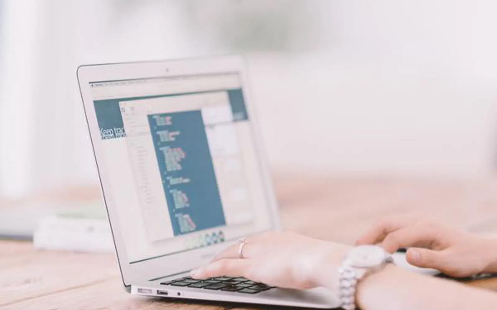 a person typing on a laptop