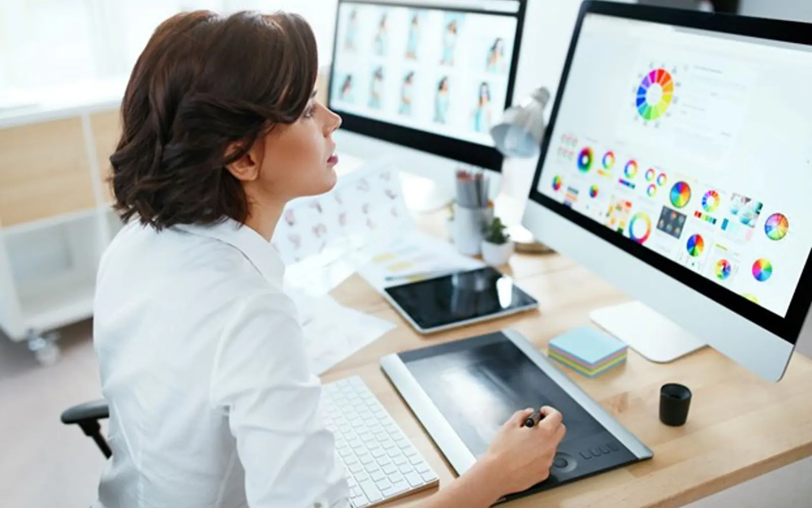 a woman using a graphic tablet