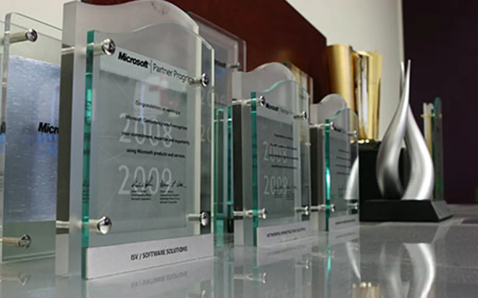 several glass trophies on a table