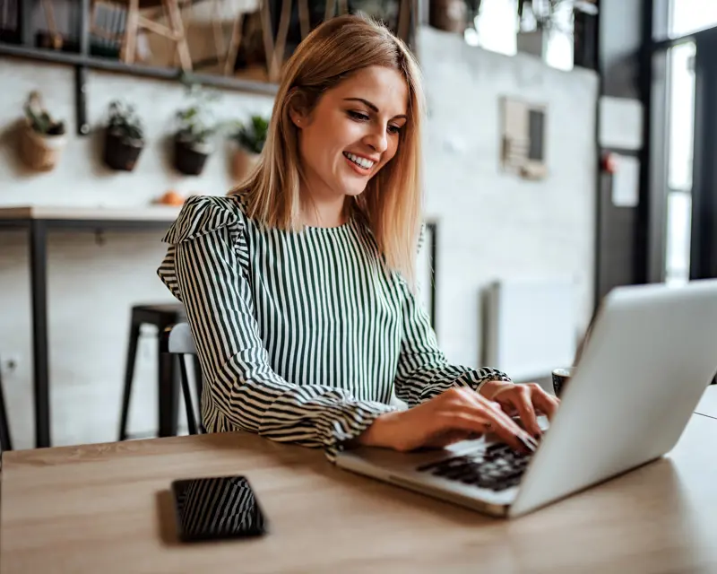 a woman using a laptop for customer journey strategy