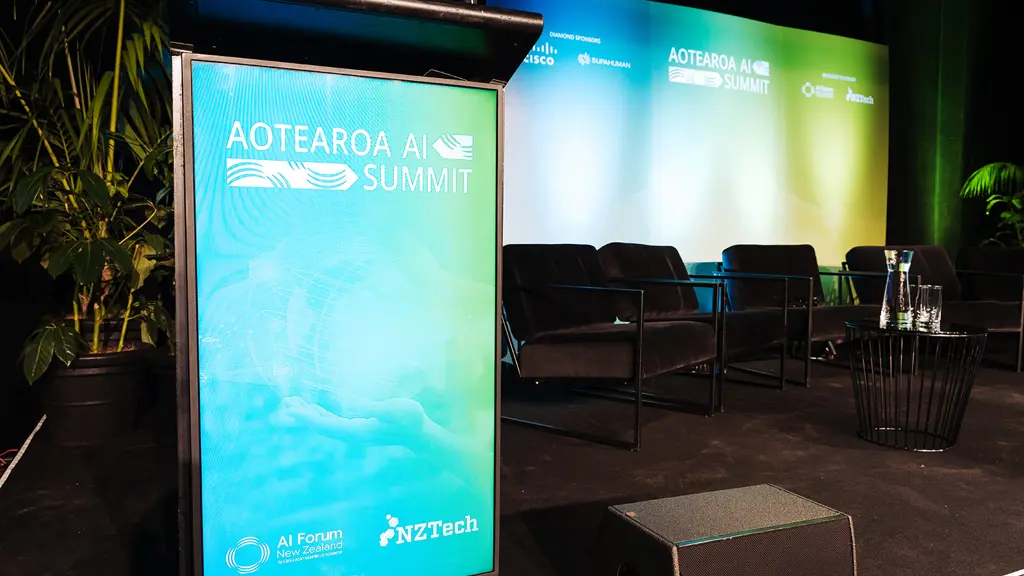 a podium with a sign in front of chairs
