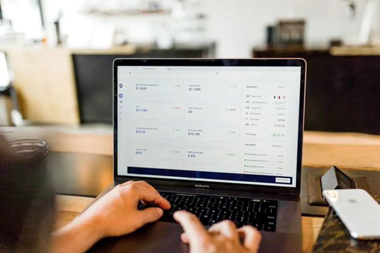 a person typing on a laptop