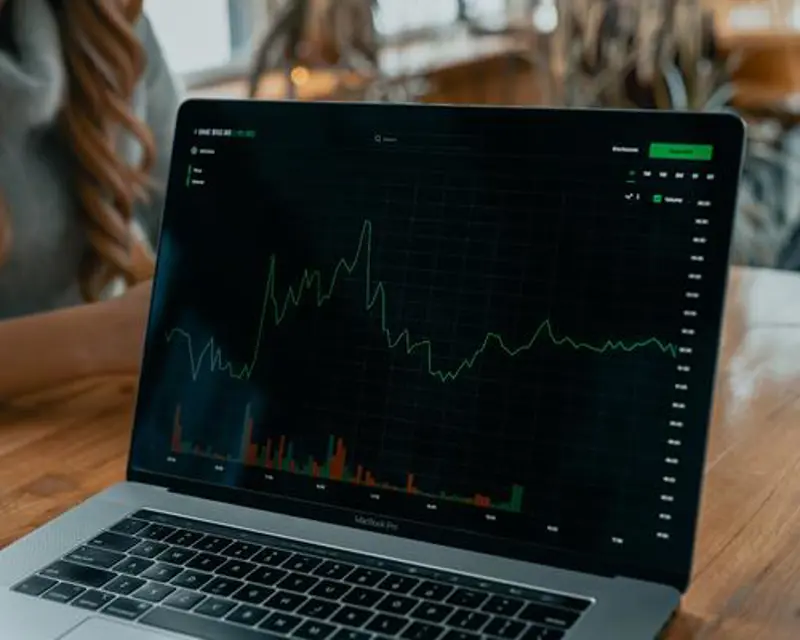 a laptop with a graph on it