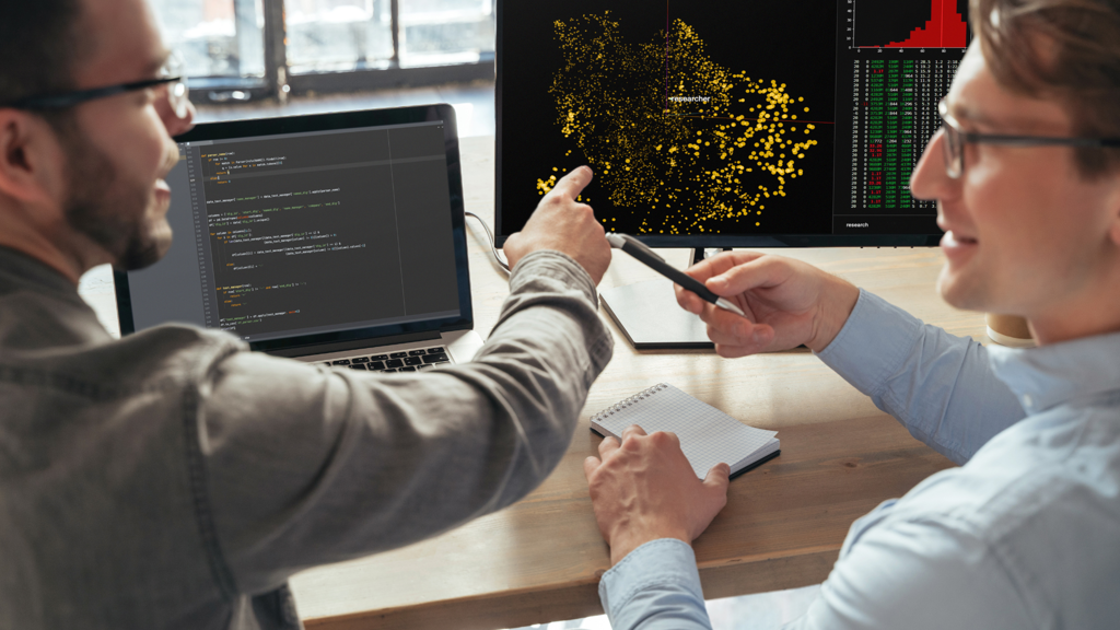 a man pointing at a computer screen