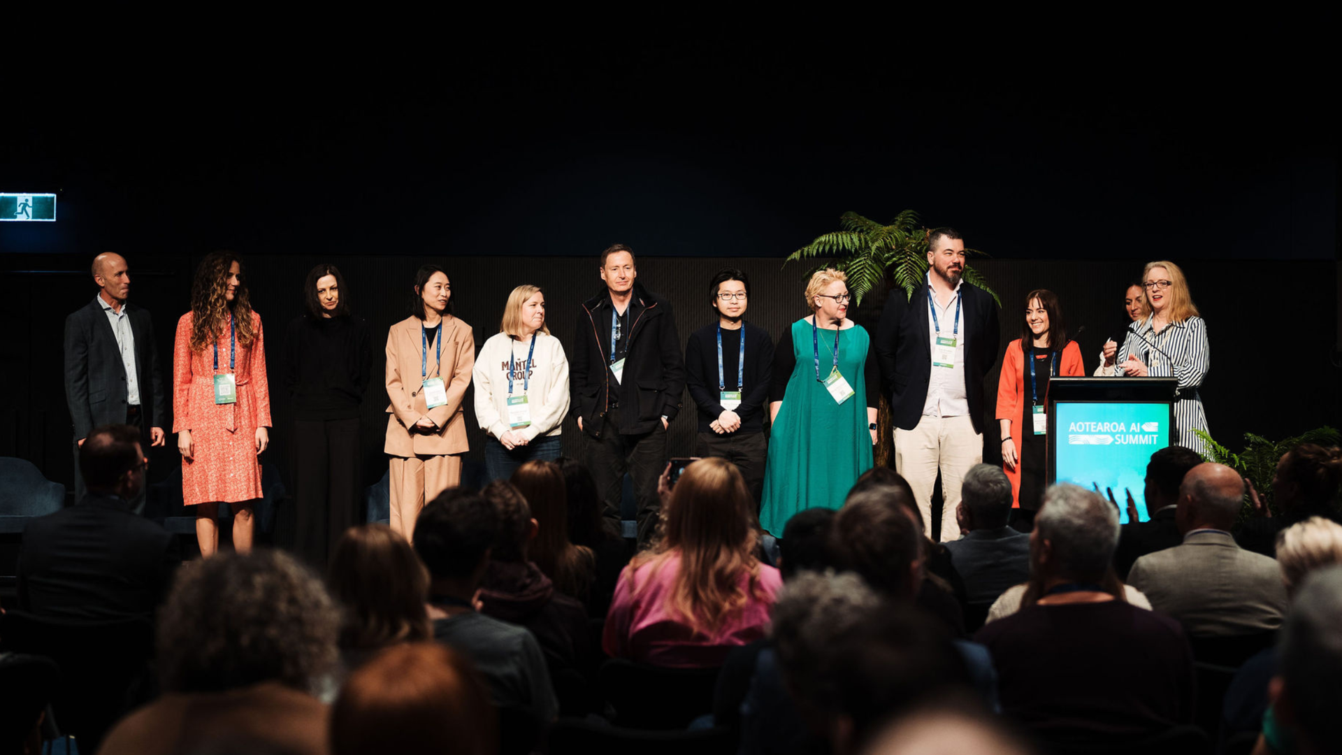 a group of people standing in front of a crowd