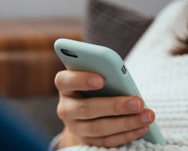 a person holding a cell phone