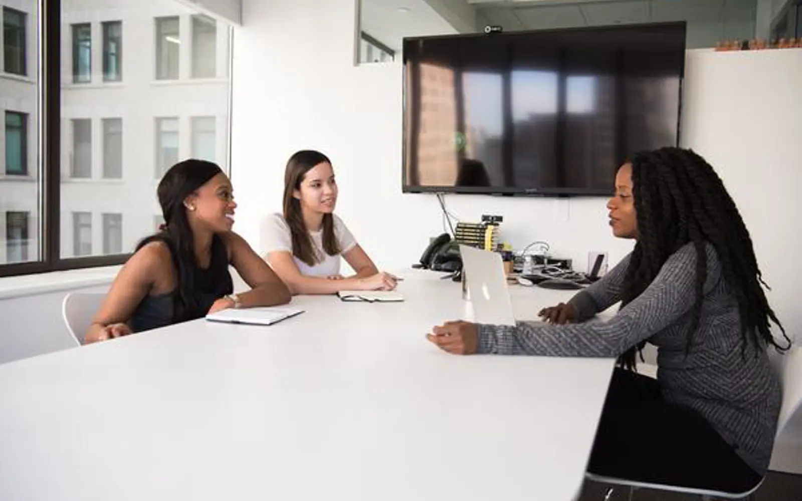 a group of women sitting at a table