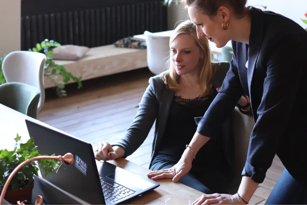 a woman looking at a laptop