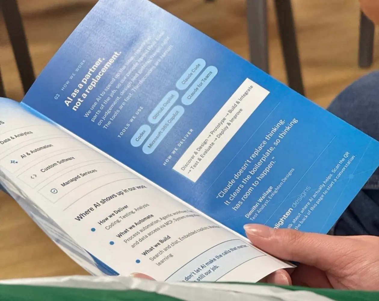 a person holding a blue booklet