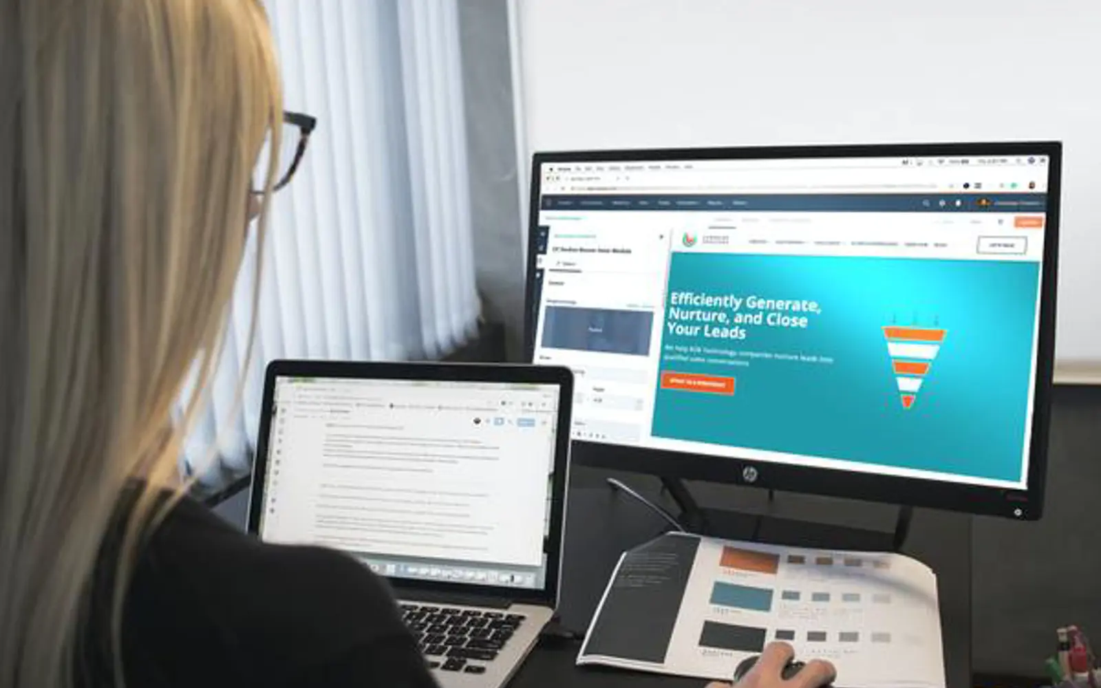 a woman looking at a computer screen