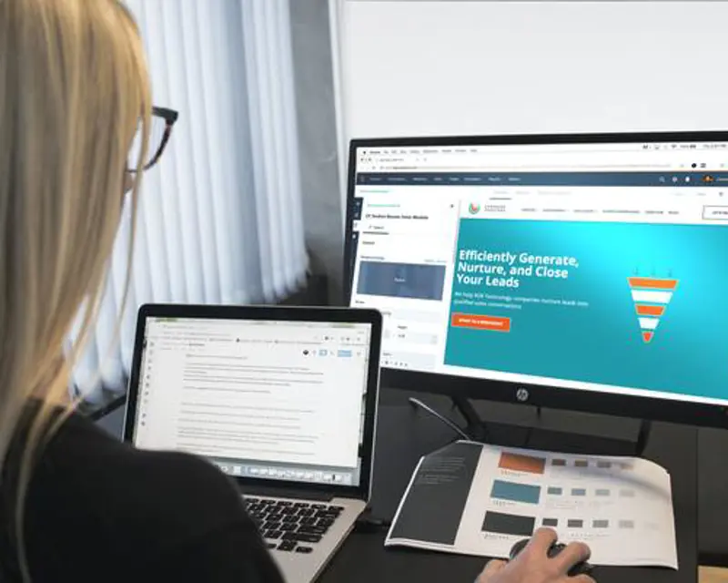 a woman looking at a computer screen